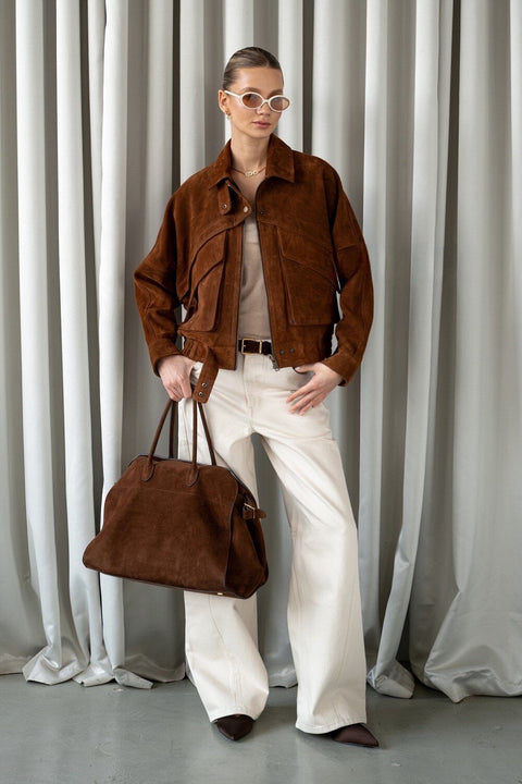 Chic cropped suede jacket in earthy brown tones, perfect for modern autumn and winter looks.
