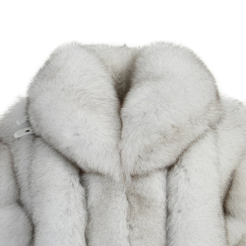 A chic natural white fox fur coat featuring a large, eye-catching collar, designed to elevate any winter wardrobe with its luxurious appeal