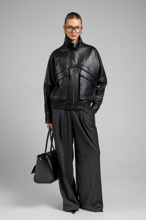 Chic cropped jacket in black genuine leather, perfect for elevated street style and winter layering.